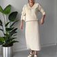Elegantes zweiteiliges Set aus Pullover und Rock mit Strassschleife für Damen