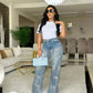 Damenjeans mit Pailletten und Quasten