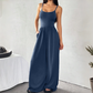 Jumpsuit mit Spaghettiträgern, weitem Bein und Taschen